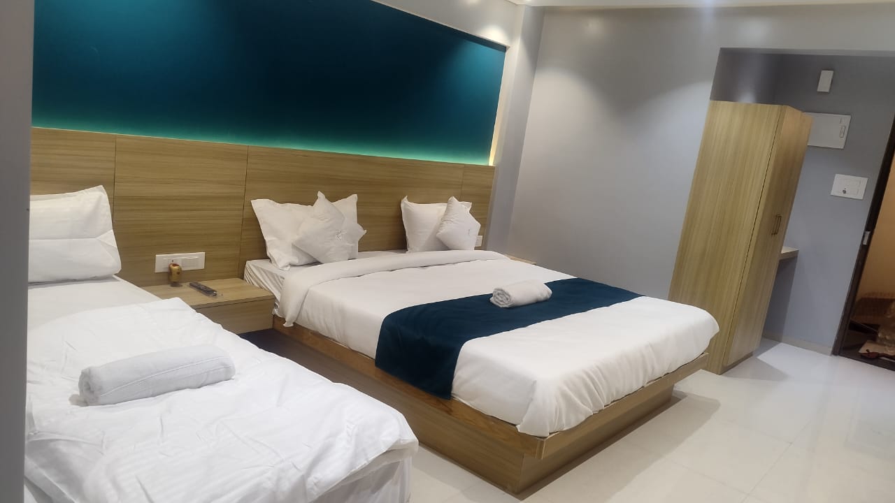 H-One guest room with multiple beds